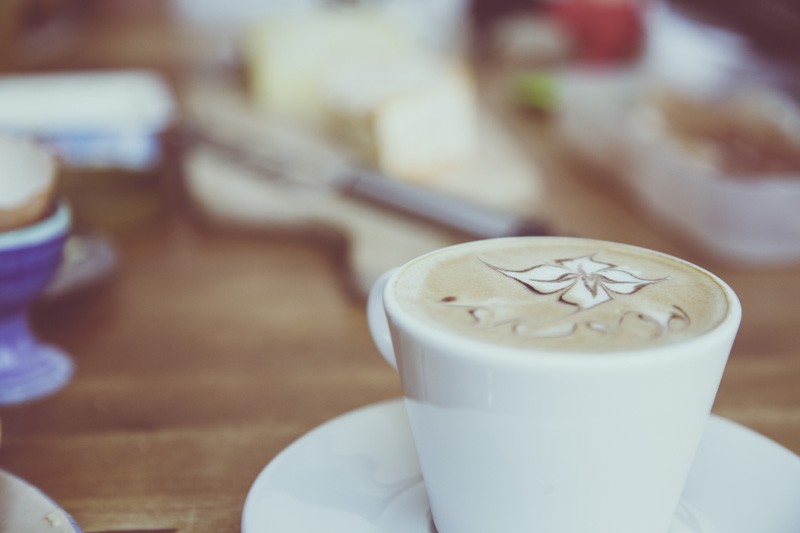 Stock photograph of a white coffee cup, not a BLAX product